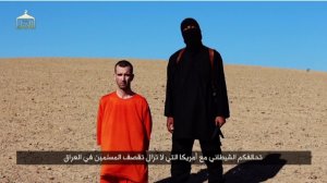A video released on Saturday, Sept. 13, 2014, shows an ISIS militant executing British aid worker David Haines.