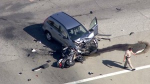 A motorist and police officer were hospitalized after a crash in Covina on Sept. 30, 2014. (CreditL KTLA)