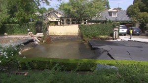 Pipe repairs were expected to take 12 hours after a water main break in Encino Monday, Sept. 8, 2014. (Credit: KTLA)