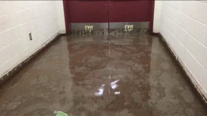 A hallway at Elsinore High School was flooded as a result of wild weather on Sept. 16, 2014. (Credit: KTLA)
