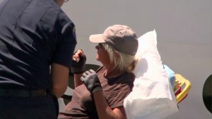 A boater is put on a stretcher in Newport Beach after being rescued several miles off shore. (Credit: KTLA) 