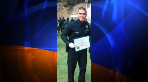 In this photo provided by LAPD Officer Erick Alcaraz's family, the 24-year-old is seen graduating from the police academy. He died in an off-duty motorcycle crash on Sept. 6, 2014. 