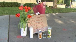 A makeshift memorial was at the scene where 57-year-old Gloria Ortiz was run over and killed by a hit-and-run driver on Sept. 14, 2014. (Credit: KTLA)