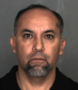 Jose Millan is seen in a booking photo. (Credit: San Bernardino County Sheriff's Department)