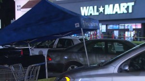 A body was discovered in the trunk of a vehicle outside a Walmart in Riverside on Saturday, Sept. 13, 2014, police said. (Credit: KTLA)