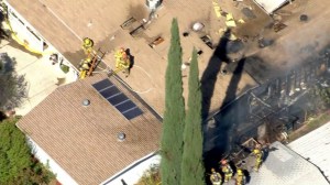 At least twos homes were damaged by flames in Santa Clarita on Sept. 11, 2014. (Credit: KTLA)