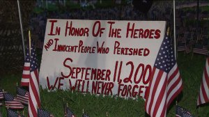 One of the signs placed on the front lawn of an Orange County firefighter's home as part of a memorial to victims of the 9/11 attacks. (Credit: KTLA) 