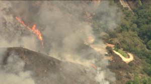 The Silverado Fire appeared to be burning near a cluster of homes on Sept. 12, 2014. (Credit: KTLA)