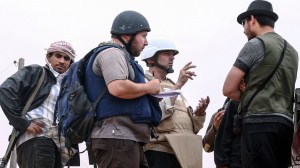 In this handout image, American journalist Steven Sotloff (center with black helmet) talks to Libyan rebels on the Al Dafniya front line on June 02, 2011, in Misrata, Libya. (Credit: Getty Images)