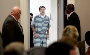 CHARLESTON, SC - SEPTEMBER 10: Former North Charleston officer Michael Slager (C) is lead into court for a bond hearing at the Charleston County Court House September 10, 2015 in Charleston, South Carolina. Slager is charged with the murder of Walter Scott. Slager shot Scott in the back when Scott ran away during a traffic stop on April 4th in 2015. (Photo by Grace Beahm-Pool/Getty Images)