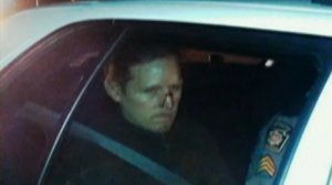 Eric Frein in a police car. 