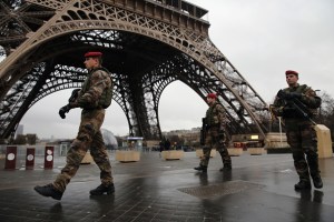 Armed security patrols around the Eiffel Tower on January 9, 2015 in Paris, France. A huge manhunt for the two suspected gunmen in Wednesday's deadly attack on Charlie Hebdo magazine has entered its third day. (Photo by Dan Kitwood/Getty Images)