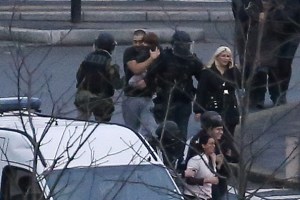 Members of the French police special forces evacuate hostages, including a child, after launching the assault to end a hostage-taking drama at a Jewish supermarket in Porte de Vincennes, eastern Paris. (Photo: THOMAS SAMSON/AFP/Getty Images)