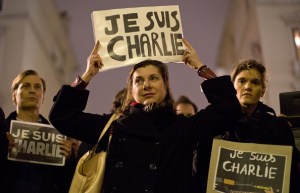 A woman holds up a "Je Suis Charlie" placard at a vigil outside The French Institute in London on January 9, 2015 for the 12 victims of the attack on the Paris offices of satirical weekly Charlie Hebdo. (Photo: JUSTIN TALLIS/AFP/Getty Images)