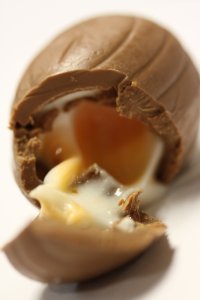  A close-up photograph of a Cadbury Cream Egg broken up, yolk spilled. (Credit: CNN)