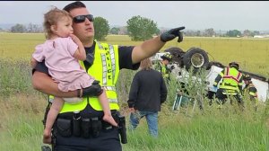 Brighton Police Officer Nick Struck sings to little girl to calm her