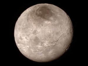 NASA releases a new image of Pluto's largest moon Charon during a news conference Wednesday.