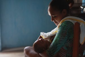 Oxitec -- a subsidiary of the biotech firm Intrexon -- is working to control the mosquito-borne Zika virus outbreak in Brazil with its genetically modified mosquitoes. Rafela Santos is seen here holding her son Luiz Felipe. Her son was born with microcephaly.