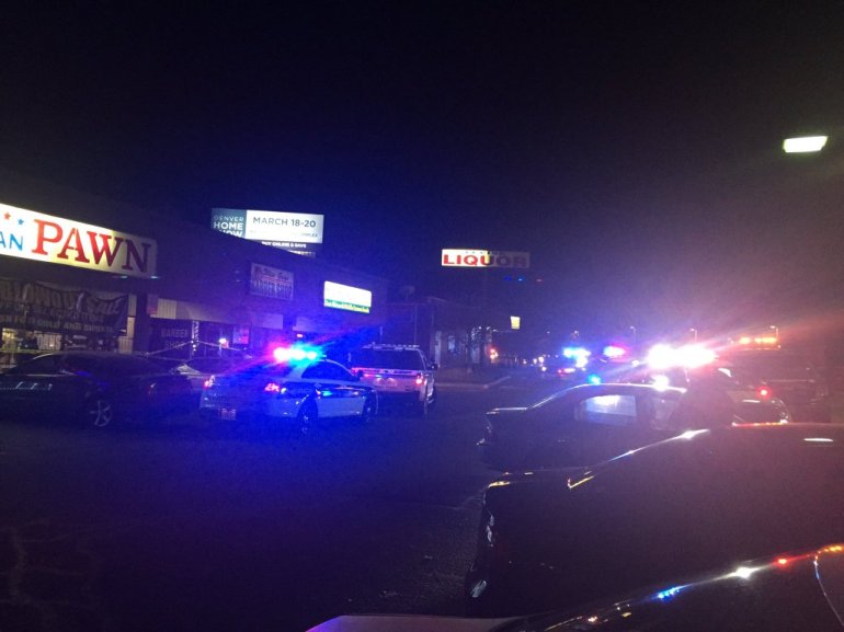 Scene after shooting, robbery at All American Pawn