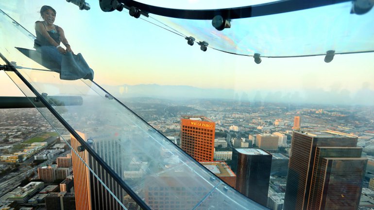 A guest rides the SkySlide in Los Angeles, California. (Photo: Mark Davis/Getty Images for Ogilvy PR)