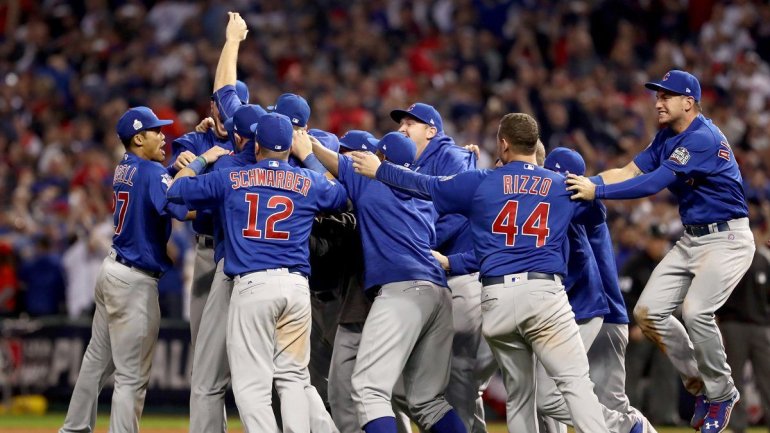 The Chicago Cubs celebrate after defeating the Cleveland Indians 8-7 in Game Seven of the 2016 World Series on November 2, 2016 in Cleveland, Ohio. (Photo: Elsa/Getty Images)