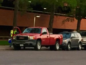 Construction worker parks on street