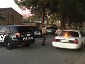 SWAT and other law enforcement swarm the area looking for suspects from the mass shooting at the Inland Resource Center in San Bernardino.