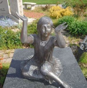 An empty-handed statue to the memory of children after the theft of the butterflies it used to hold. (Photo courtesy: Willowick Police)