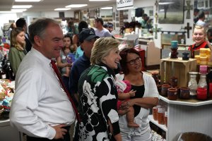 ASHLAND, OH - JULY 31: Democratic presidential nominee former Secretary of State Hillary Clinton and democratic vice presidential nominee U.S. Sen Tim Kaine (D-VA) greet patrons at Grandpa's Cheese Barn on July 31, 2016 in Ashland, Ohio. Hillary Clinton and Tim Kaine are wrapping up their three-day bus tour through Pennsylvania and Ohio. (Photo by Justin Sullivan/Getty Images)