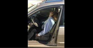 A startling new photo shows an Indiana woman passed out behind the wheel of a car after an apparent heroin overdose with a syringe clutched in her fist.