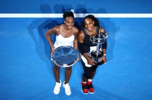 MELBOURNE, AUSTRALIA - JANUARY 28: Serena Williams of the United States poses with the Daphne Akhurst Trophy alongside Venus Williams of the United States, posing with the runners up plate after the Women's Singles Final on day 13 of the 2017 Australian Open at Melbourne Park on January 28, 2017 in Melbourne, Australia. (Photo by Cameron Spencer/Getty Images)