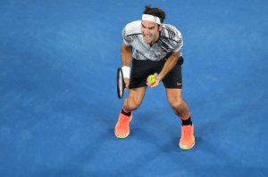 MELBOURNE, AUSTRALIA - JANUARY 29: Roger Federer of Switzerland celebrates winning championship point in his Men's Final match against Rafael Nadal of Spain on day 14 of the 2017 Australian Open at Melbourne Park on January 29, 2017 in Melbourne, Australia. (Photo by Quinn Rooney/Getty Images)