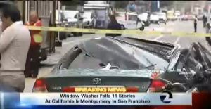 A car was crushed when a window washer fell while working Friday morning in San Francisco. Courtesy: KTVU