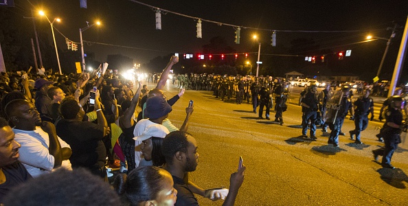 BATON ROUGE, LA -JULY 09: Baton Rouge police in riot gear move in on protesters for a second night in a row on July 9, 2016 in Baton Rouge, Louisiana. Alton Sterling was shot by a police officer in front of the Triple S Food Mart in Baton Rouge on July 5th, leading the Department of Justice to open a civil rights investigation. (Photo by Mark Wallheiser/Getty Images)