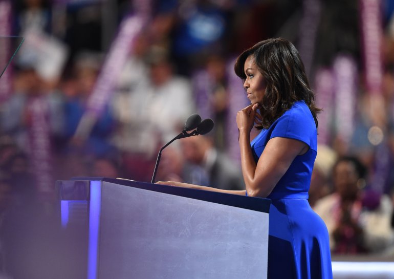 US First Lady Michelle Obama addresses delegates on Day 1 of the Democratic National Convention at the Wells Fargo Center in Philadelphia, Pennsylvania, July 25, 2016. / AFP / Robyn BECK (Photo credit should read ROBYN BECK/AFP/Getty Images)