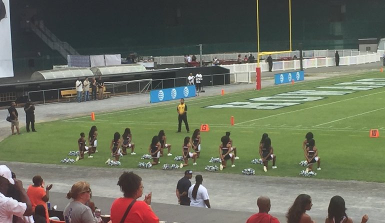 Cheerleaders at Howard University take a knee during school football game in order to join the growing national protest around racism and police brutality. (Credit: Zachary Johnson)