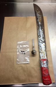 The machete and drug paraphernalia found on Valencia. (Courtesy: Fairfield Police Department)