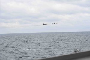 The US military has released several photos of what it says were SU-24 Russian fighter jets "buzzing" the deck of a US warship in the Black Sea on February 10, 2017.