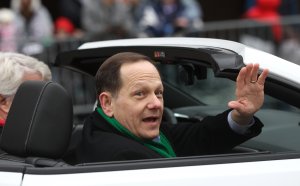 St. Louis Mayor Francis Slay waves to parade goers during the Thanksgiving Day Parade in St. Louis on November 24, 2016. Photo by Bill Greenblatt/UPI