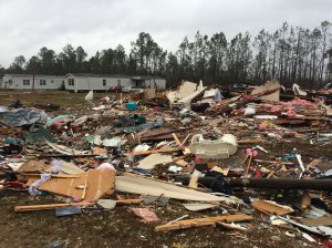 Across the South, communities are set to begin picking up the pieces as rough weather gives way to partly cloudy skies and moderate wind. One of the most chaotic scenes unfolded Sunday at the Sunshine Acres mobile home park near Adel in Cook County, Georgia.