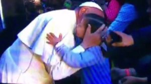 Pope Francis embraces 6-year-old Maria Girault of Coronado during his trip to Mexico City.