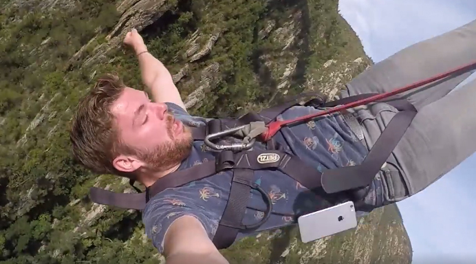 Moment when the phone drops out of his pocket.