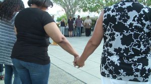 A community group held a vigil for slain SDPD Officer Jonathan De Guzman Wednesday night.