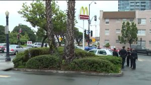 Police investigate after the body of a man was found on a street near City College.
