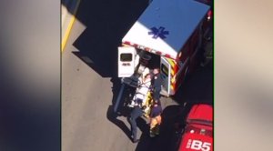A student was being placed in an ambulance after suffering burns from a fire at UC San Diego on Nov. 6, 2016. (Credit: Gerard Belohnte)