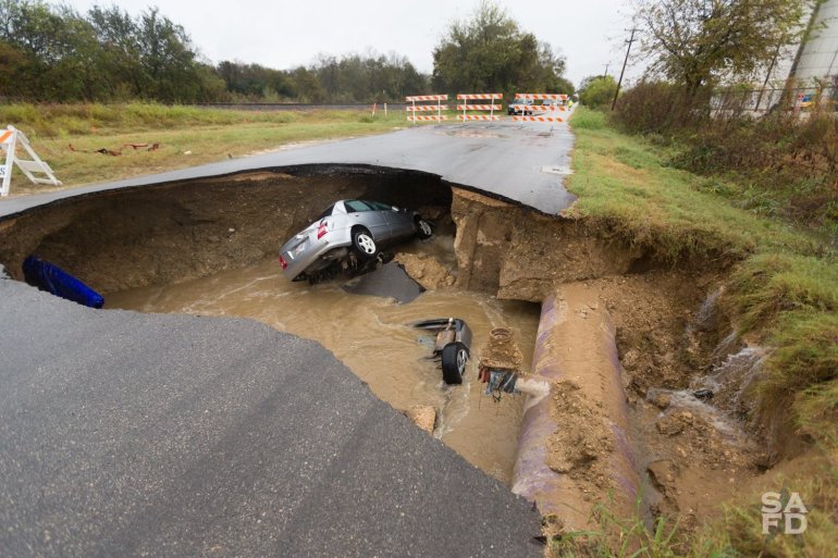 Dora Linda Nishihara, a Bexar County Sheriff Deputy, died after her car fell into a sinkhole Sunday, December 4, 2016 in San Antonio, Texas, according to a post on the Bexar County Sheriff’s Office Twitter page. (Credit: San Antonio Fire Department)