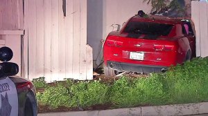 A red Camaro crashed into a home in El Cajon while trying to evade a sheriff's deputy.