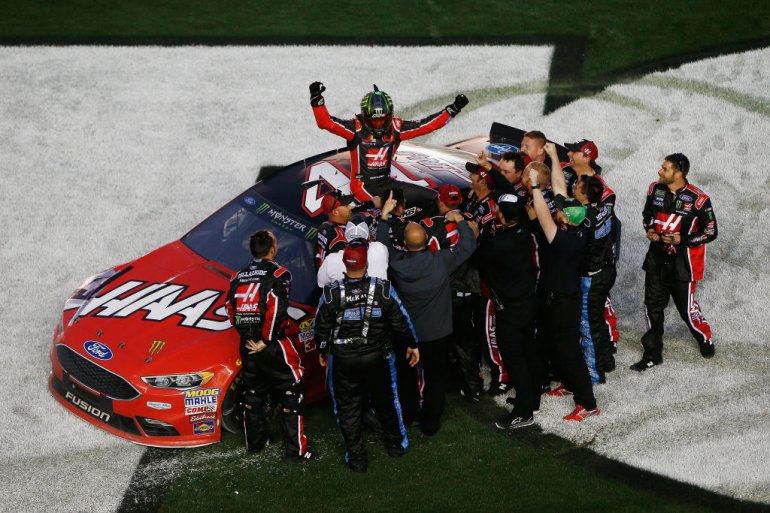 Kurt Busch, driver of the #41 Haas Automation/Monster Energy Ford, celebrates with his crew after winning the 59th Annual DAYTONA 500 at Daytona International Speedway on February 26, 2017 in Daytona Beach. (Getty Images)