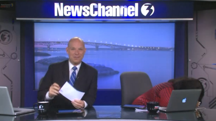 During a conversation about Overland Park, Kansas, ranking #1 in cities to raise a family, WTKR news anchor Blaine Stewart heard the wrath of one Overland Park fan. His co-anchor hides behind her computer. 