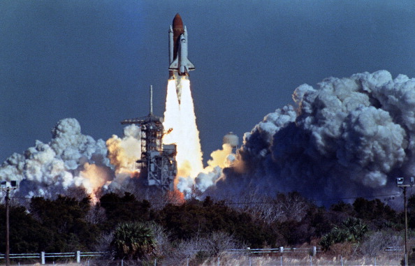 US space shuttle Challenger lifts off 28 January 1986 from a launch pad at Kennedy Space Center, 72 seconds before its explosion killing it crew of seven. Challenger was 72 seconds into its flight, travelling at nearly 2,000 mph at a height of ten miles, when it was suddenly envelope in a red, orange and white fireball as thousands of tons of liquid hydrogen and oxygen fuel exploded. AFP PHOTO NASA (Photo credit should read BOB PEARSON/AFP/Getty Images)
